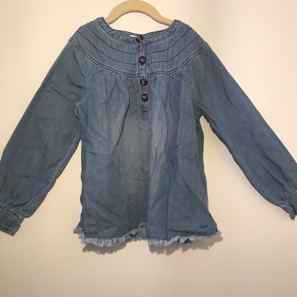 Long sleeved denim shirt.